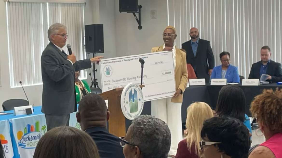 The U.S. Department of Housing and Urban Development presents a check to the Jacksonville Housing Authority. 