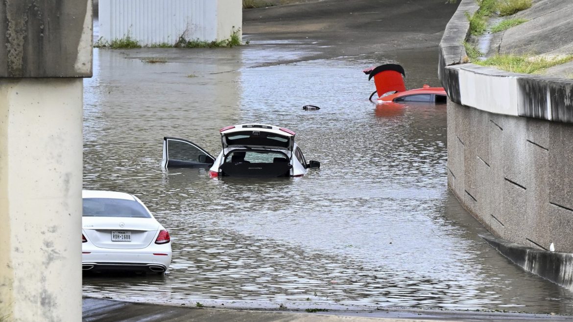 Flooding strands vehicles near downtown Houston on Monday, July 8, 2024, after Hurricane Beryl came ashore in Texas. 