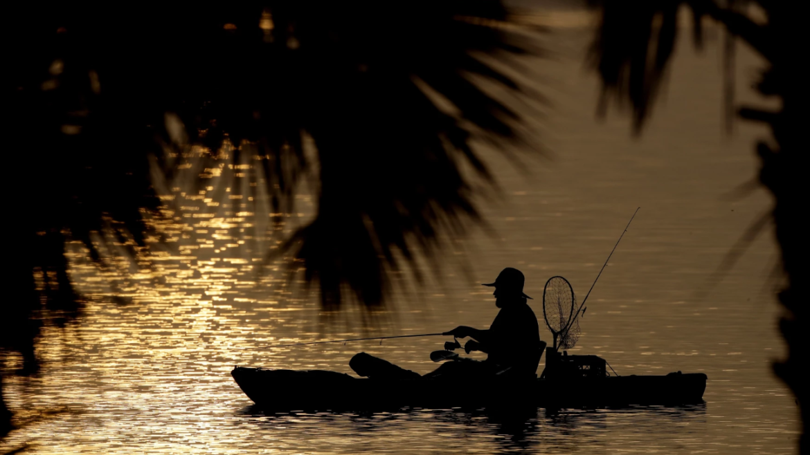 Fisher in kayak