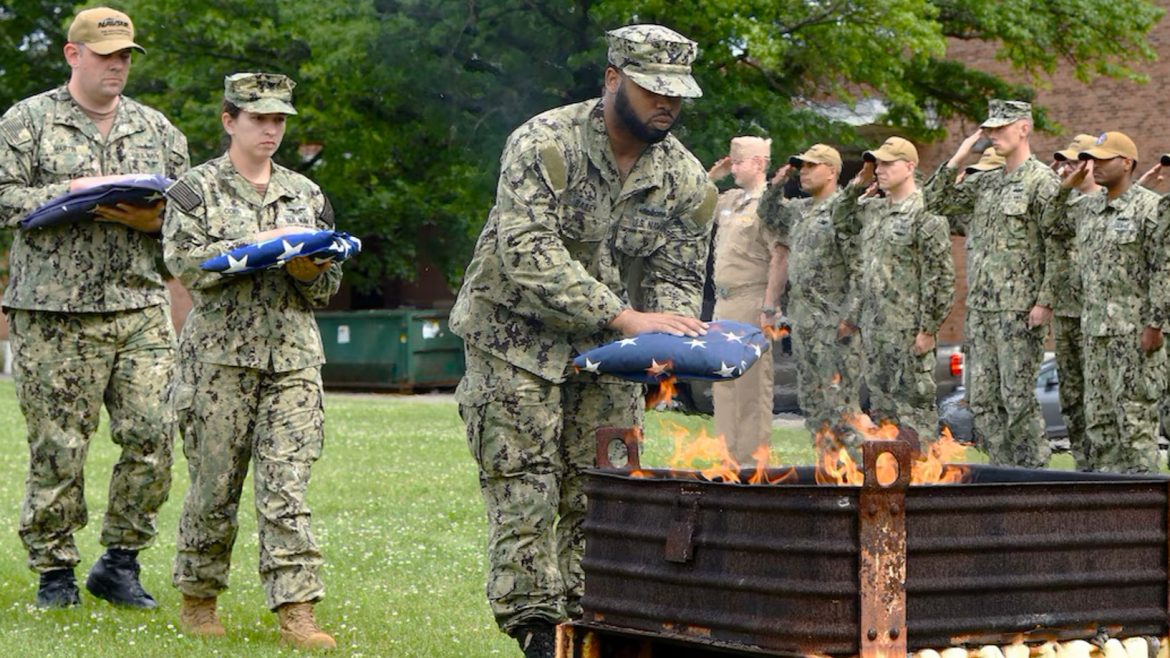 Soldiers disposing of U.S. flags