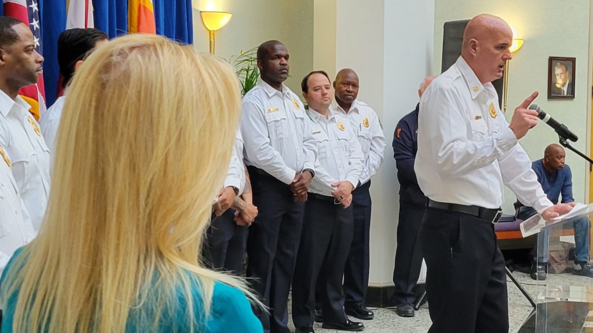 Mayor Donna Deegan, left, listens as Jacksonville Fire and Rescue Chief Keith Powers speaks during a news conference Thursday, Nov. 30, 2023. 