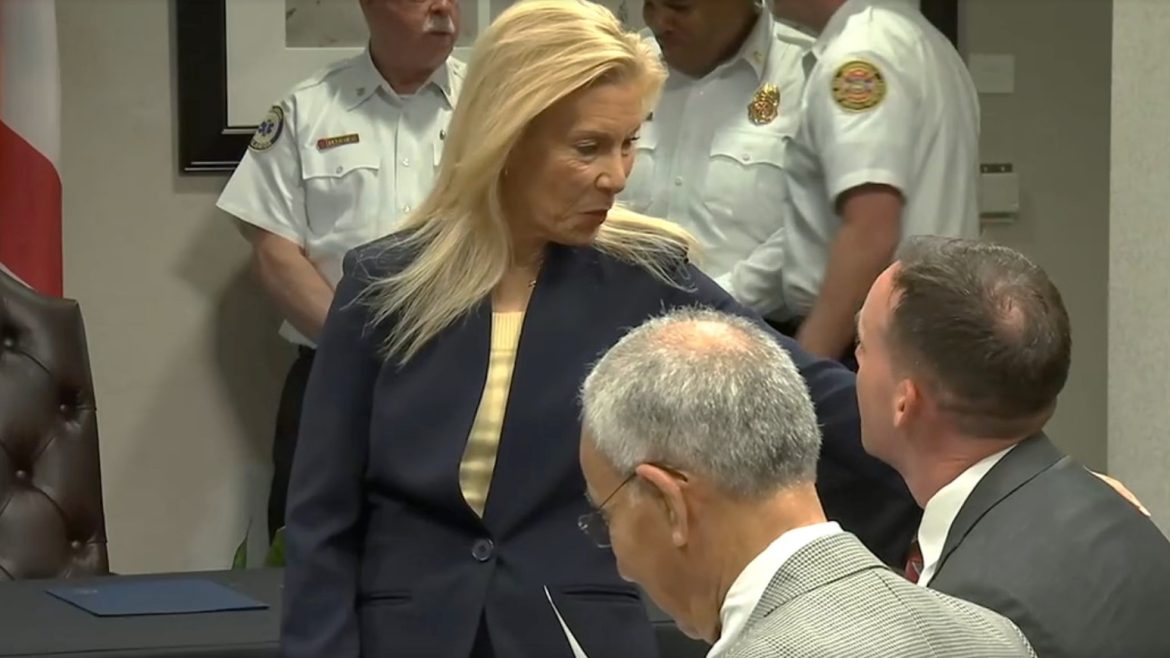 Mayor Donna Deegan speaks with City Council member Rory Diamond before signing his Heroes Act bill into law on Friday, March 29, 2024. 