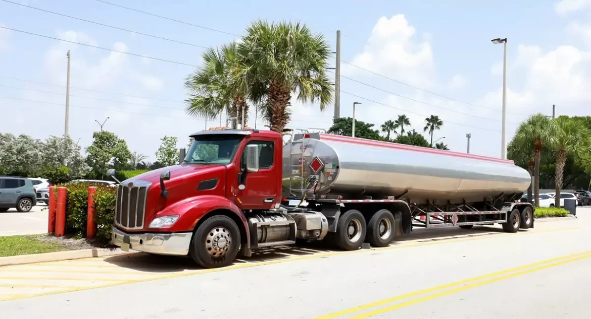 Fuel truck delivering gas at a station in Davie.